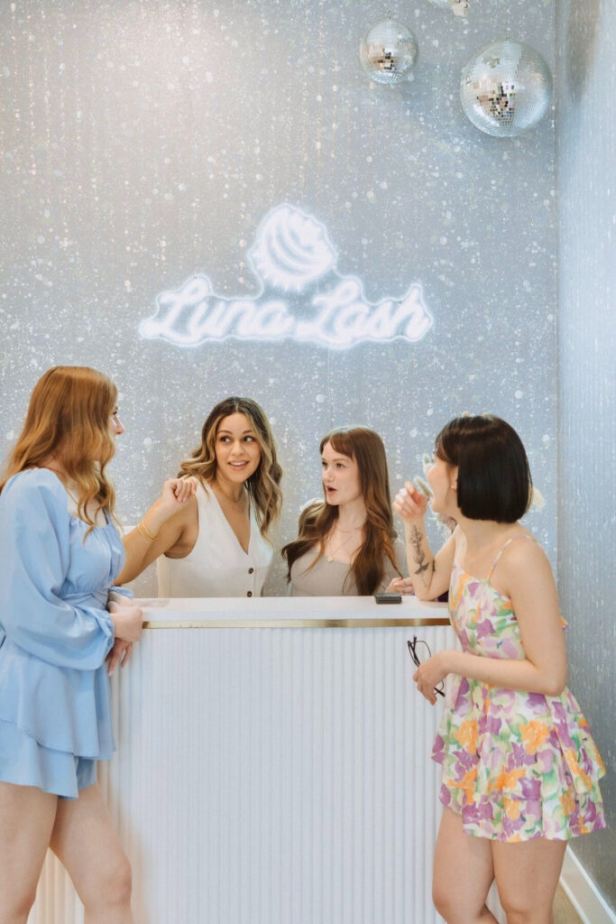 Austin lash experts smiling at front desk
